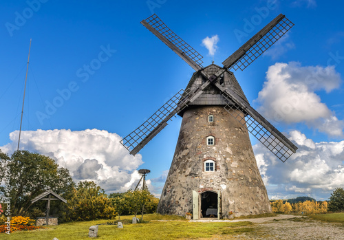 Old windmill by summer day