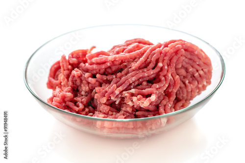 Minced pork in a glass bowl.