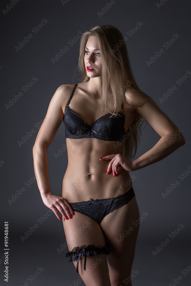 Fototapeta premium Advertising underwear. Tanned model with fit body