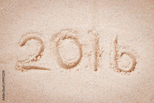 New Year 2016 write on sand beach.