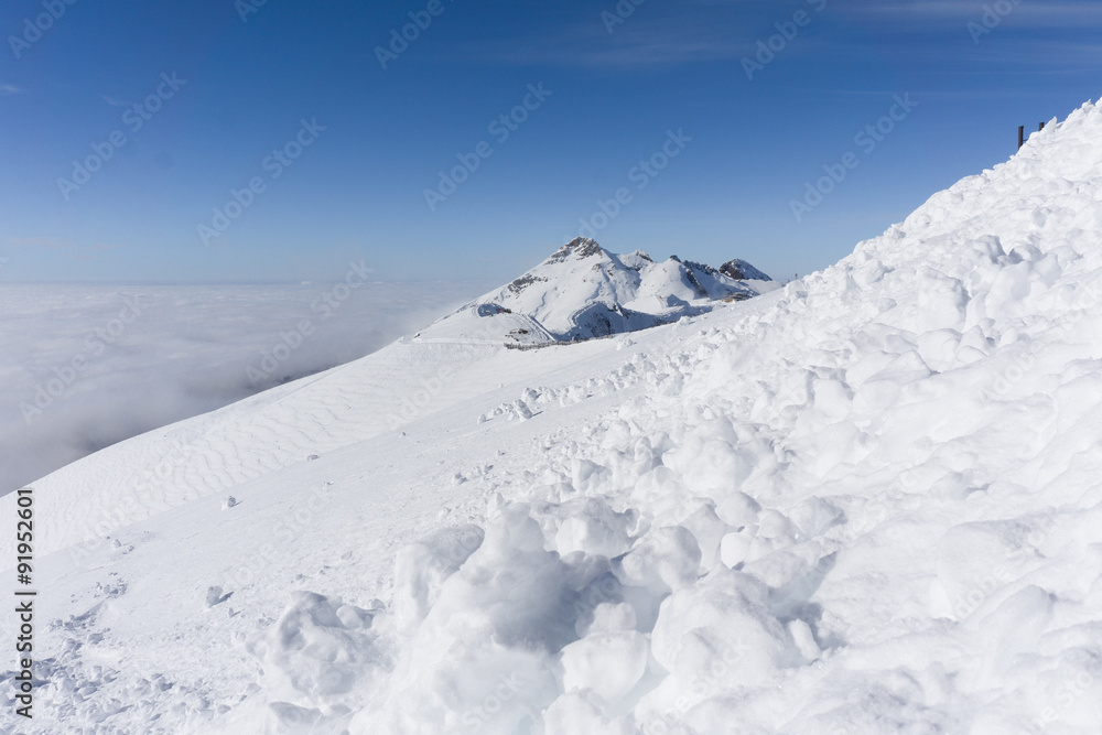 View on mountains and blue sky above clouds