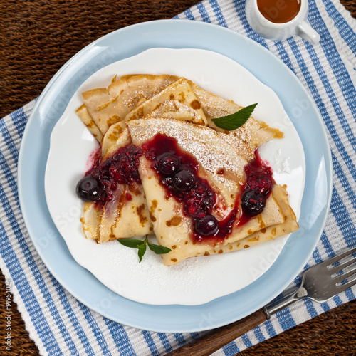 Blintzes or Pancakes with Blueberries. Selective focus. photo