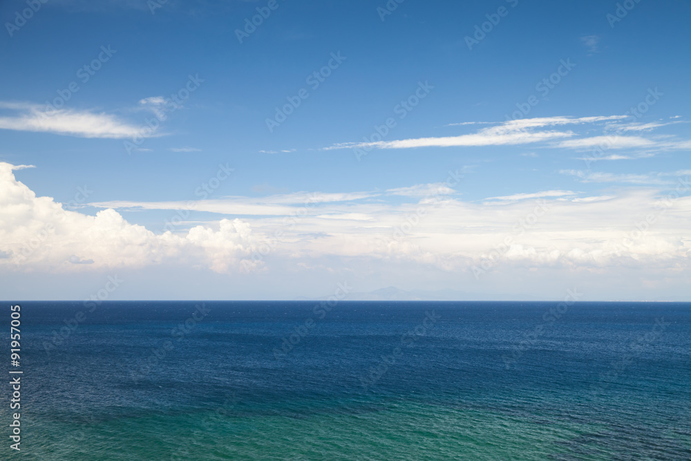 Seascape with blue water and cloudy sky Seascape with blue water and cloudy sky