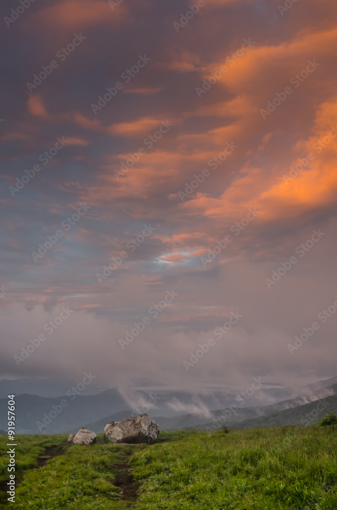 Pink Clouds Over Rocks on Round Bald