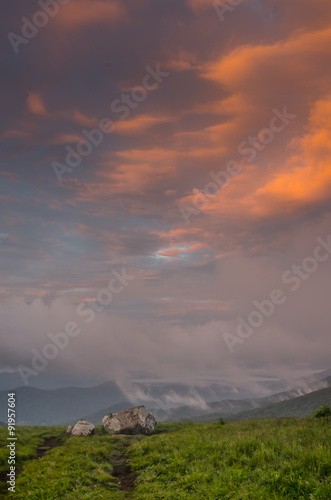 Pink Clouds Over Rocks on Round Bald