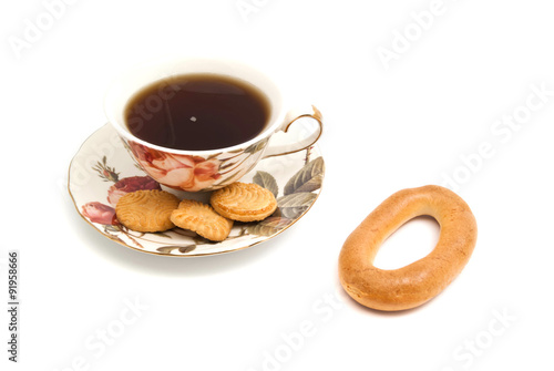 mug of tea, cookies and bagel