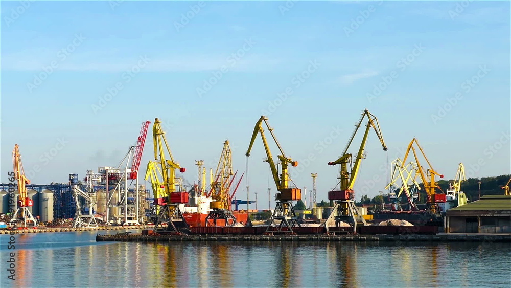 tall orange industrial cranes in the port of Odessa tall orange industrial cranes in the port of Odessa