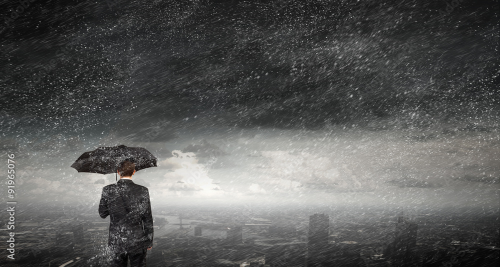 Obraz premium Businessman with umbrella