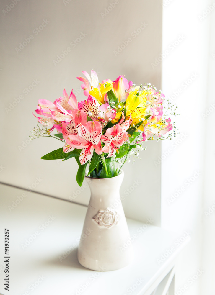 Alstroemeria flowers in vase on table Alstroemeria flowers in vase on table