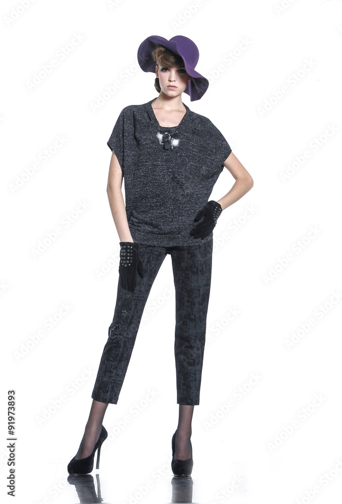Full body fashion model posing in hat posing on white background Full body fashion model posing in hat posing on white background