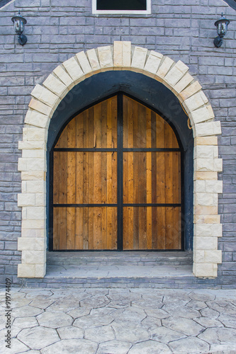Wooden door in stone wall