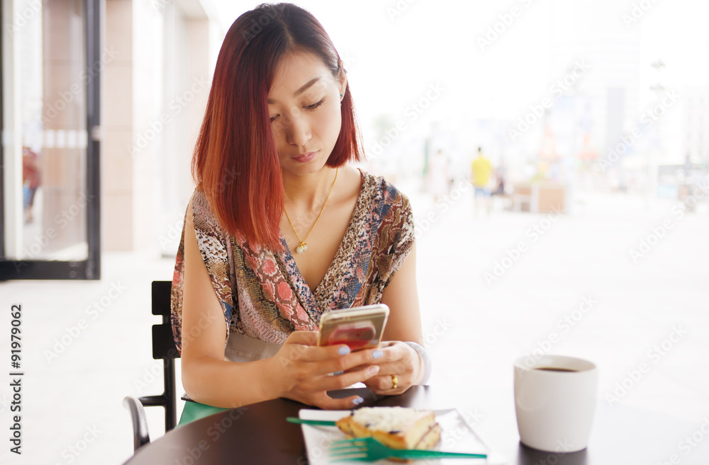 Asian girls use cellular phones Asian girls use cellular phones