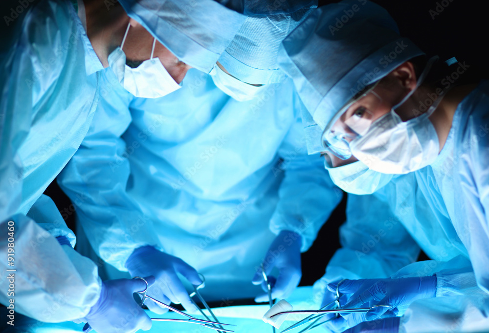Team surgeon at work in operating room Team surgeon at work in operating room
