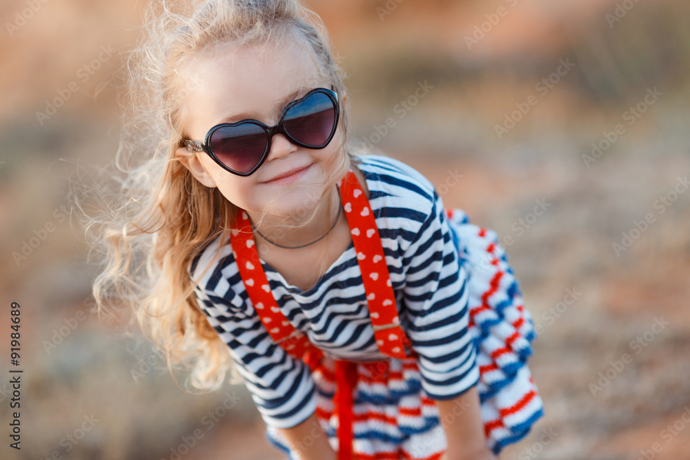 Happy little girl at the seaside in the summer. Happy little girl at the seaside in the summer.