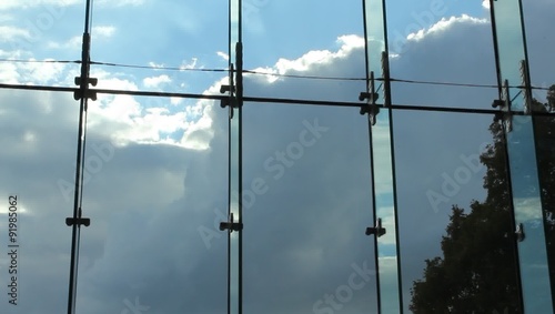 Window to the world with the Museum of the History of Polish Jews.
Movement of clouds over large windows of the museum complements the experience of visitors.  photo