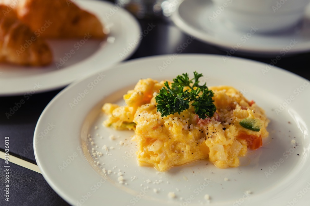 Omelets, breakfast served with coffee and croissants. Omelets, breakfast served with coffee and croissants.