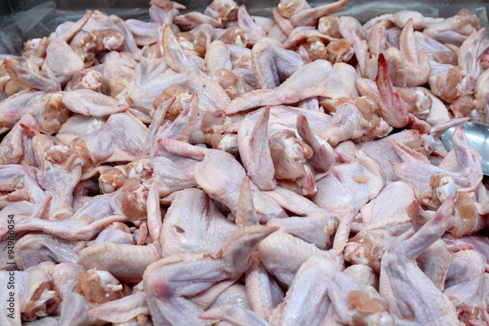 Raw chicken wings in the market