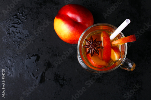 stewed peach on a black background