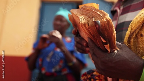 Ugandan Woman Holding Old Bible Low Shot