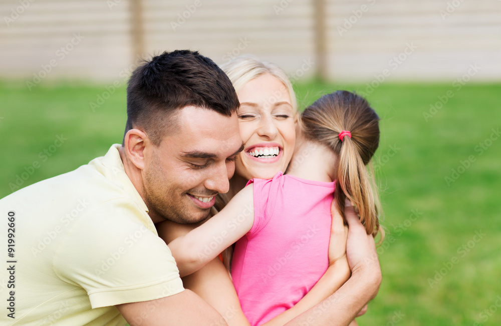 happy family hugging outdoors happy family hugging outdoors