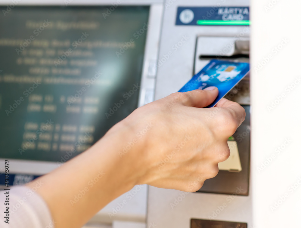 Female hand - close up - cash withdrawals at ATMs Female hand - close up - cash withdrawals at ATMs