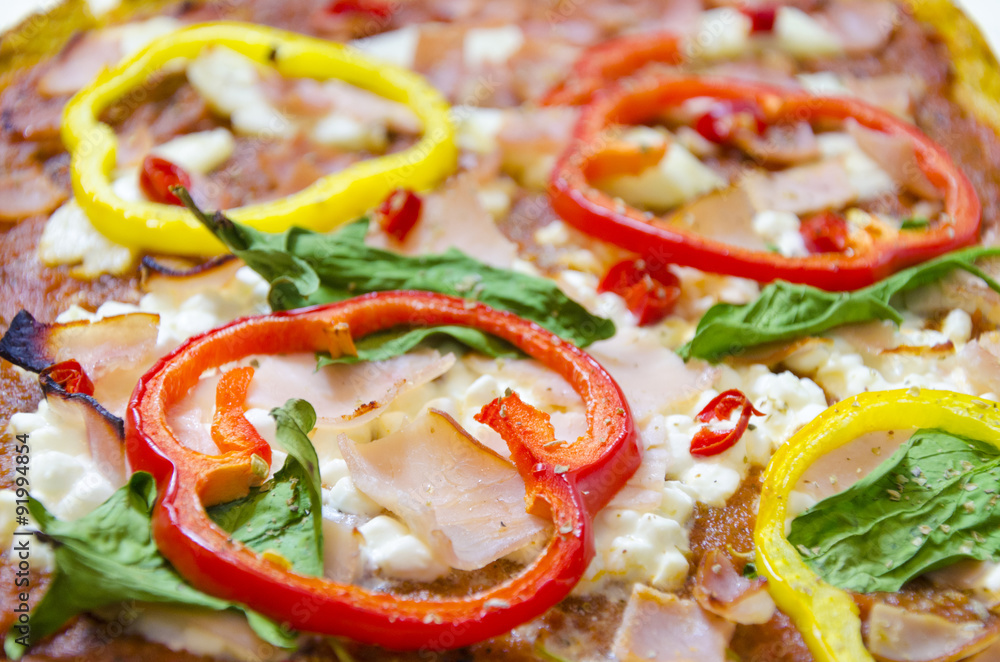 Pizza toppings. Oven baked pizza topped with halloumi, cottage