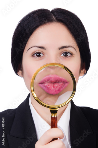 Business woman holding magnifying glass isolated on white