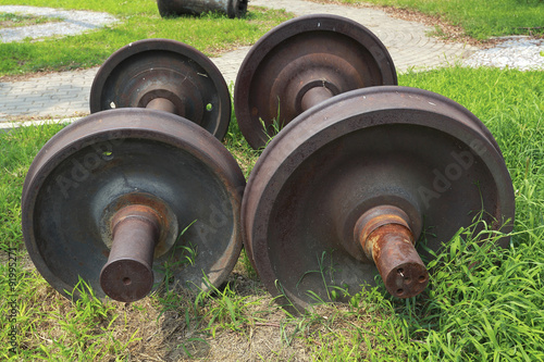 Obraz na plátne Abandoned  train two wheels on the grass