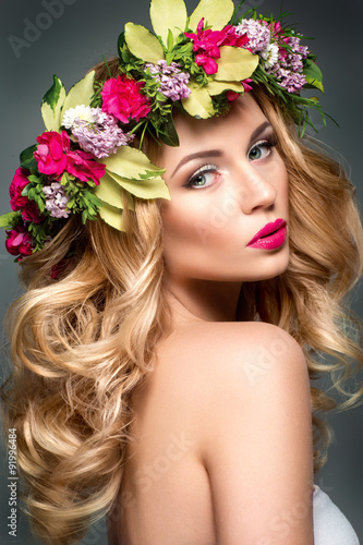 Beautiful woman with flowers in hair © demidenko