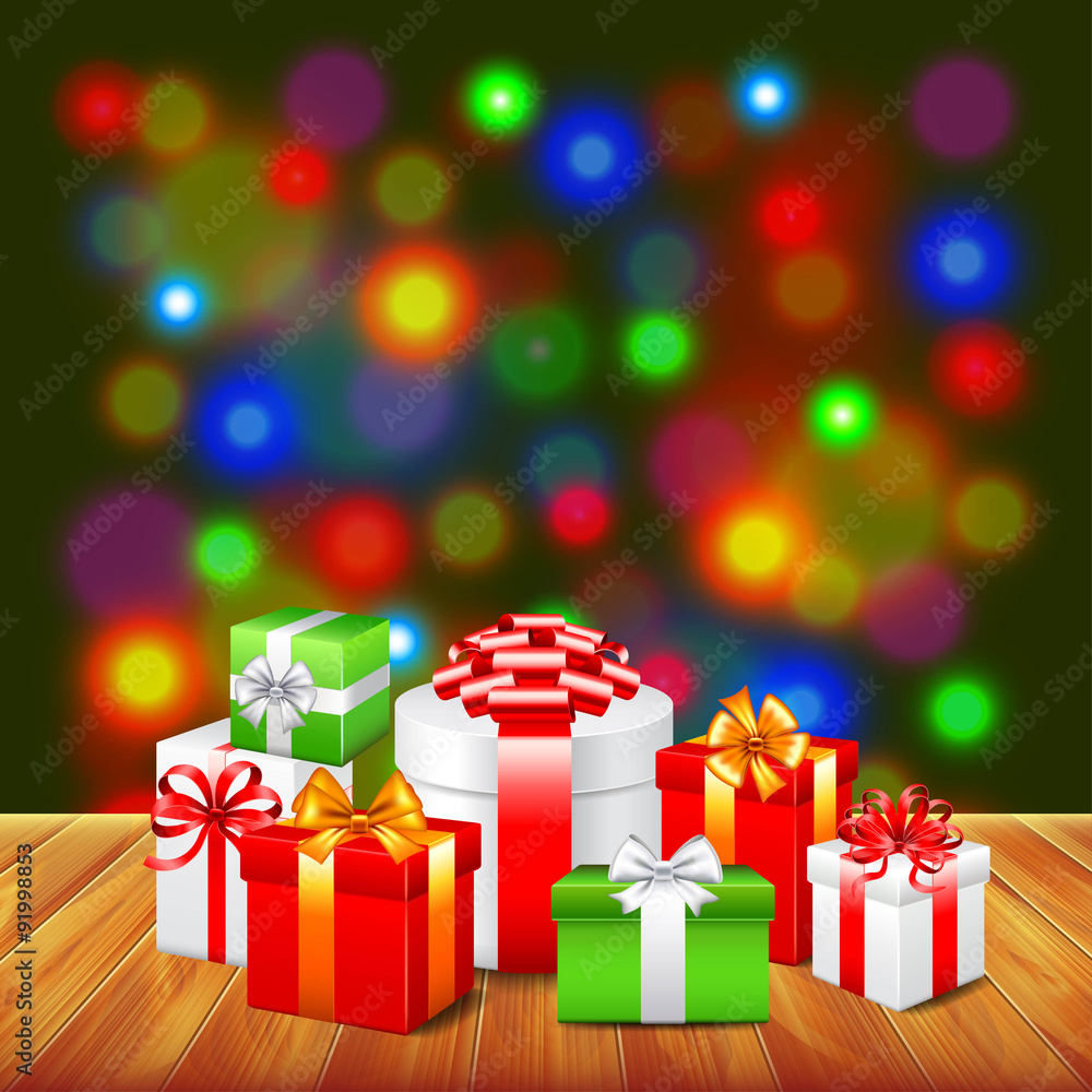 Obraz premium Christmas gifts on wooden table colorful background
