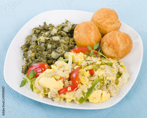 Ackee & Saltfish - Traditional Jamaican dish made of salt cod and ackee fruit. Served with callaloo and johnny cakes.
 photo