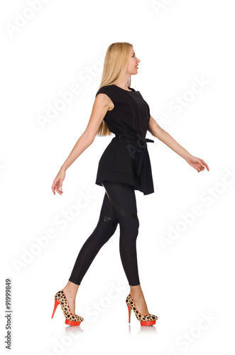 Pretty woman in tight black pants isolated on white