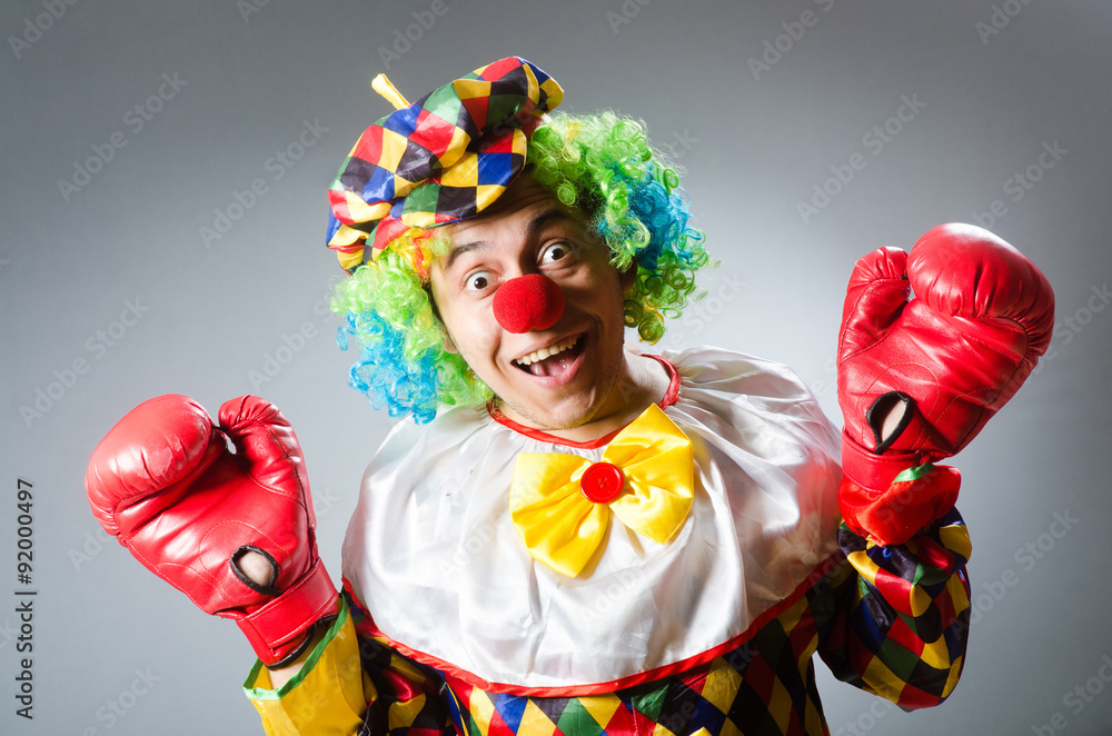 Clown with boxing gloves isolated on white Clown with boxing gloves isolated on white