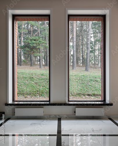 Interior of modern empty space with big windows