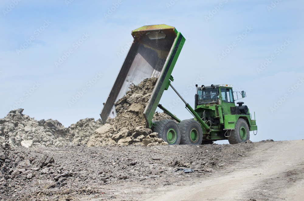 Dump truck unloading dirt Dump truck unloading dirt
