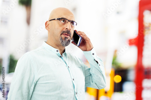 Man talking mobile phone outdoors