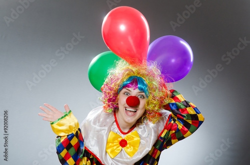 Clown with balloons in funny concept