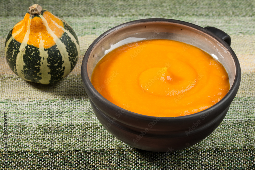 Pumpkin soup in a ceramic bowl Pumpkin soup in a ceramic bowl