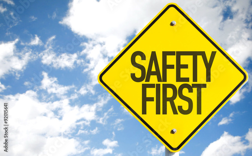 Safety First sign with sky background photo