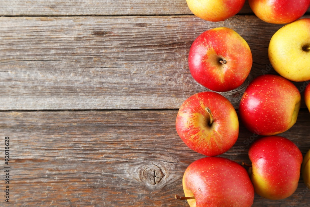 Red apples on grey wooden background Red apples on grey wooden background