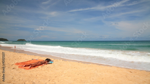 Fototapeta Naklejka Na Ścianę i Meble -  Foreign woman got tan on beach in Phuket