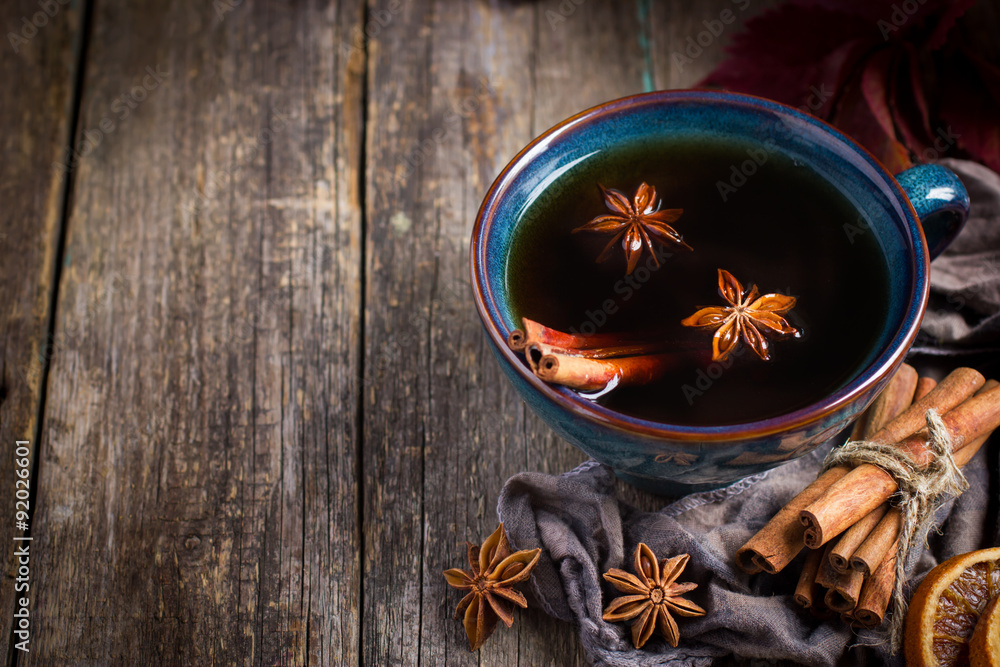 Cup of hot spicy tea with anise and cinnamon, selective focus Cup of hot spicy tea with anise and cinnamon, selective focus