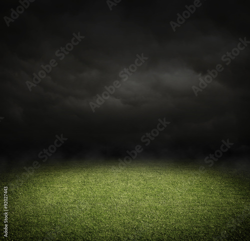 Soccer or football field at night with copy space
