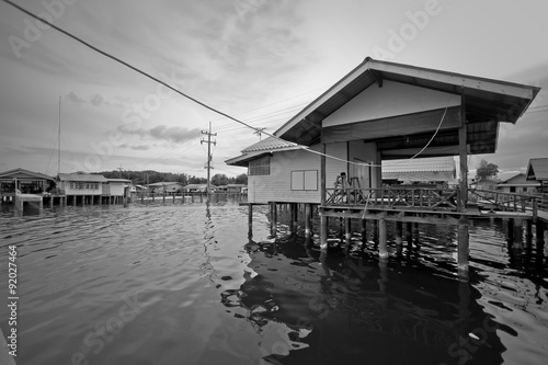 Black and white house on river © whyframeshot