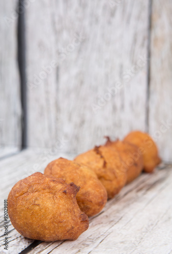 Popular Malaysian fritter snack deep fried banana balls or locally known as Cekodok Pisang  photo