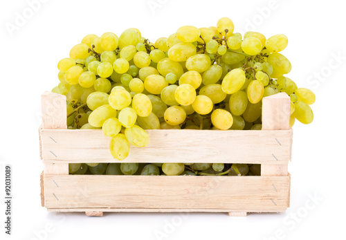 White table grapes (Vitis) in wooden crate