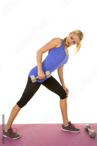 blond woman blue fitness tank stand side extend weight