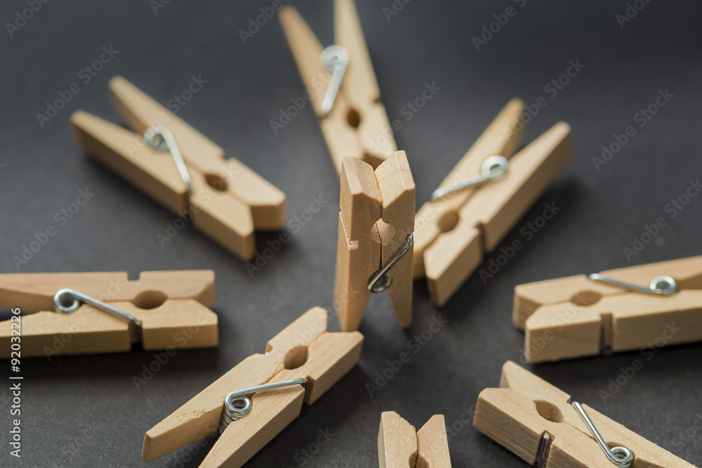 Clothespins on an abstract scene on a black background Clothespins on an abstract scene on a black background