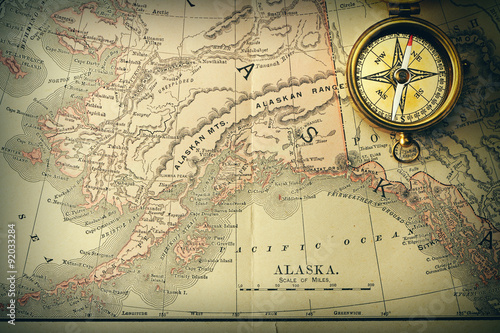 Fotografie Antique compass over old XIX century map