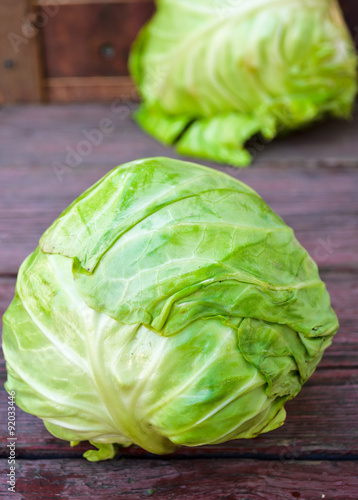 ripe white headed cabbage on a wooden table